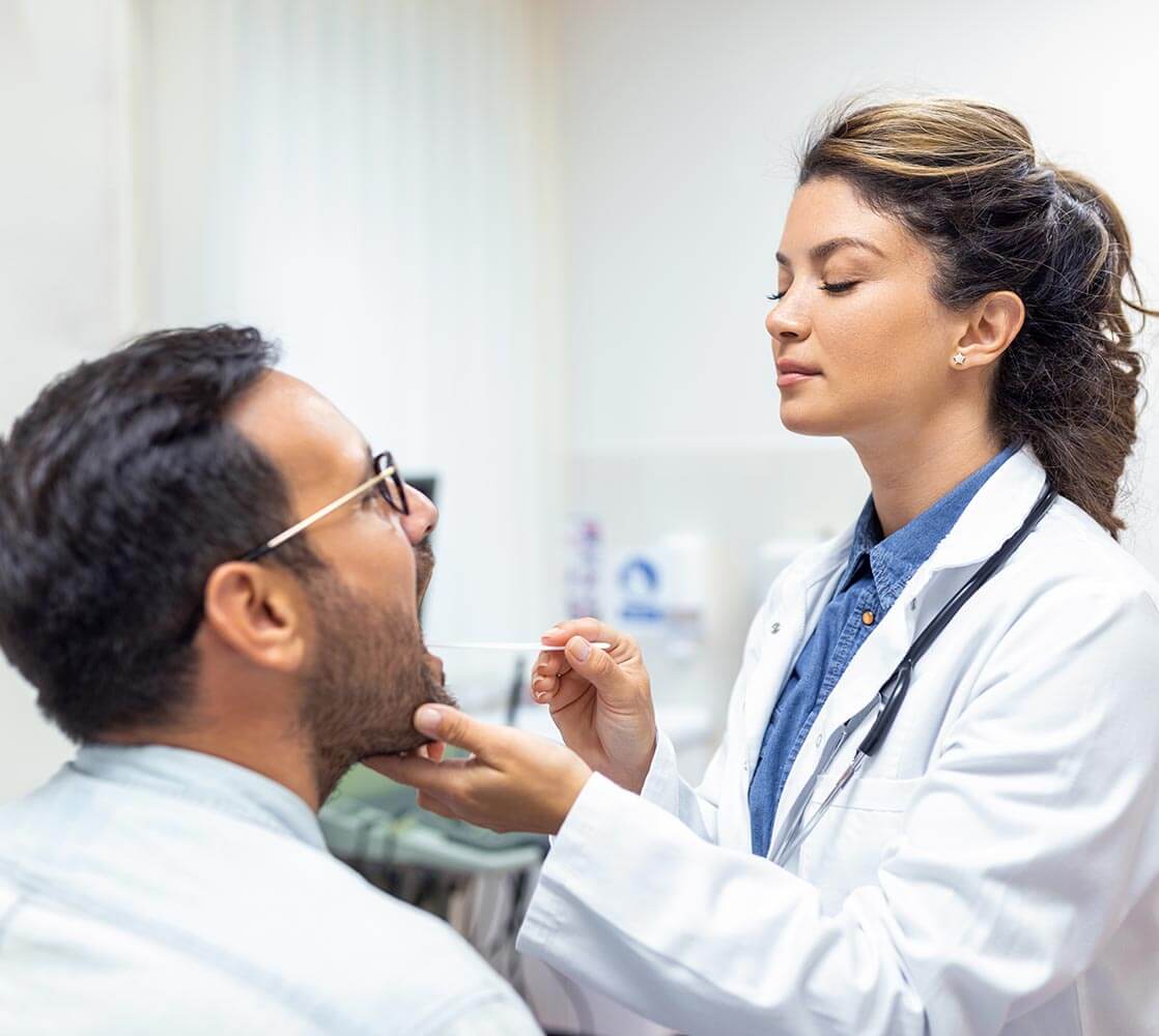 ENT doctor taking mouth swab