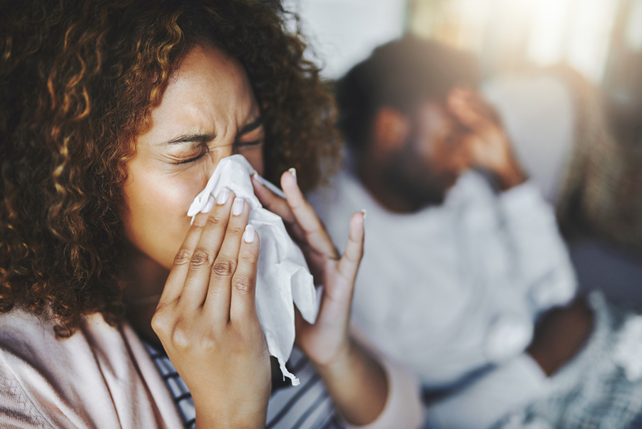 woman blowing nose