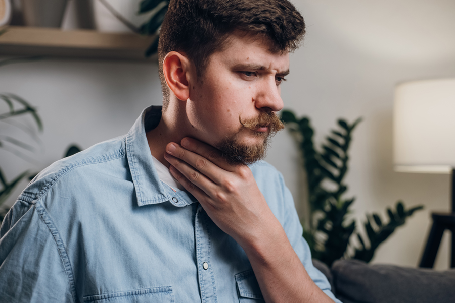 Man having trouble swallowing