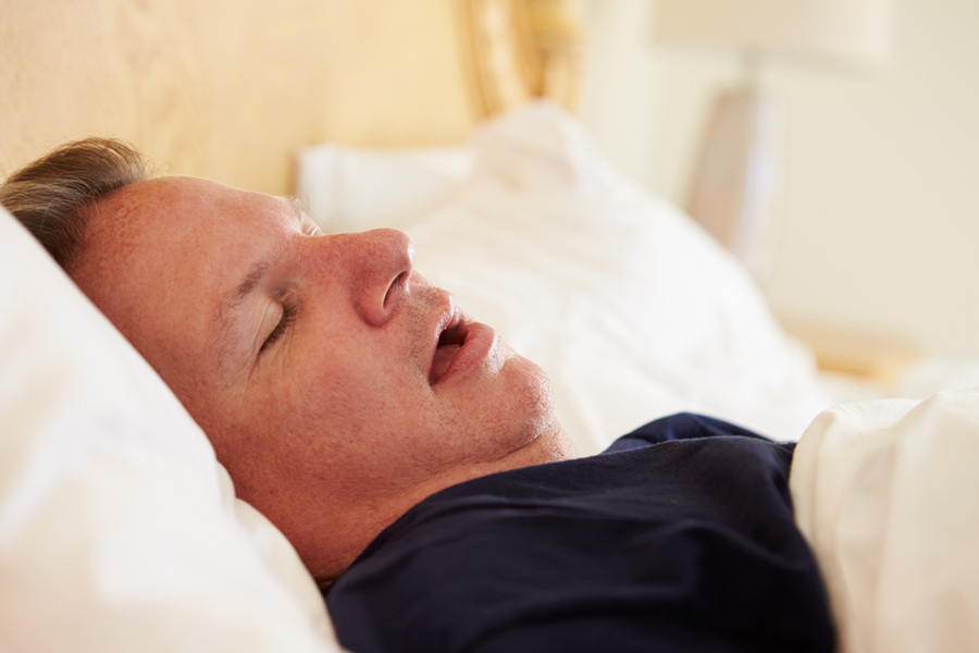 Overweight Man Asleep In Bed Snoring