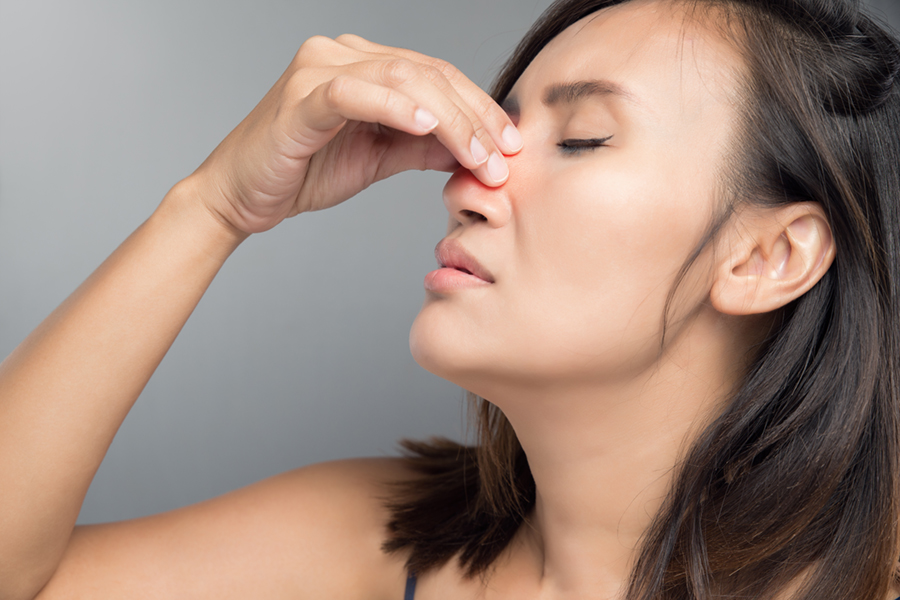 Woman with nasal congestion